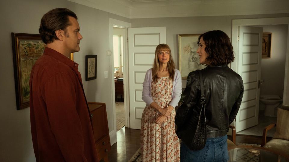 Dan (Joshua Jackson, left) and wife Beth (Amanda Peet) get a surprise visit from Alex (Lizzy Caplan) in a scene from "Fatal Attraction."