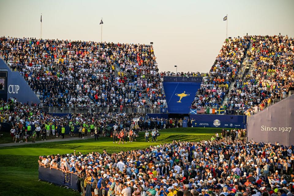 Tyrrell Hatton and Jon Rahm of Team Europe and Scottie Scheffler and Sam Burns of Team United States walk from the first tee (Getty Images)