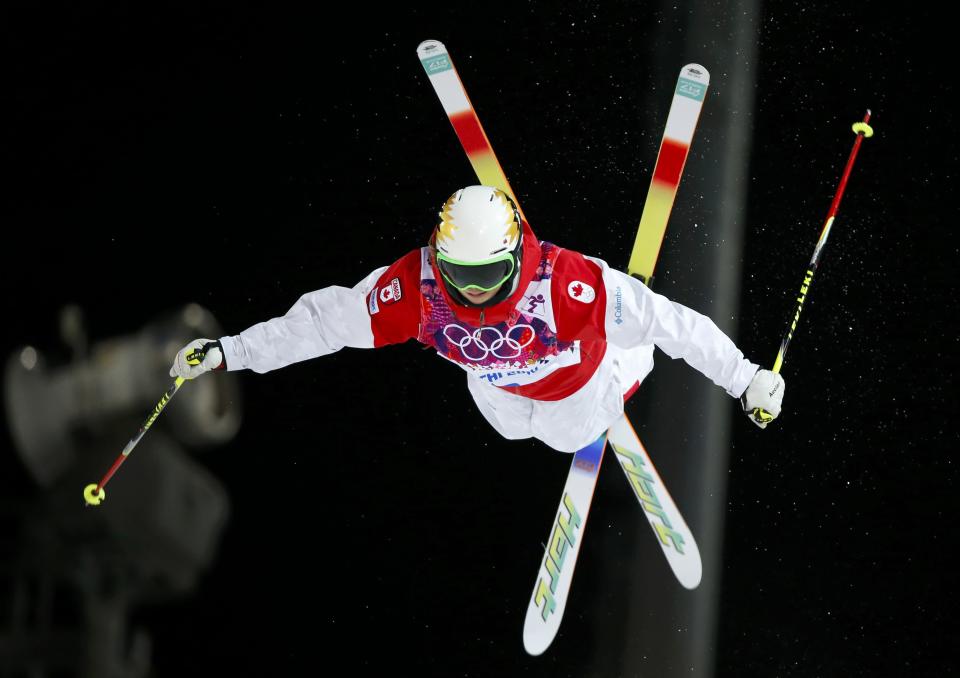Canada's Chloe Dufour-Lapointe performs a jump during the women's freestyle skiing moguls final competition at the 2014 Sochi Winter Olympic Games in Rosa Khutor