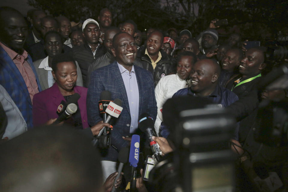 Deputy President and presidential candidate William Ruto, center, speaks to reporters after casting his vote in Kenya's general election in Sugoi, 50 kms (35 miles) north west of Eldoret, Kenya, Tuesday Aug. 9, 2022. Kenyans are voting to choose between opposition leader Raila Odinga and Ruto to succeed President Uhuru Kenyatta after a decade in power. (AP Photo/Brian Inganga)