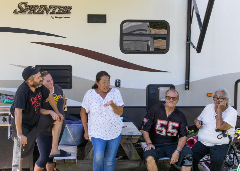 Saving Mercy resident Ruth Yamada, third from left, who has lived at Saving Mercy since 2014, got herself an attorney who put a stop to her eviction temporarily as she spoke about it Friday morning, July 22.