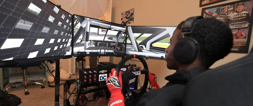 NASCAR driver Rajah Caruth uses his iRacing simulator in his apartment bedroom to compete in a race at Atlanta Motor Speedway on Friday, July 1 2022.