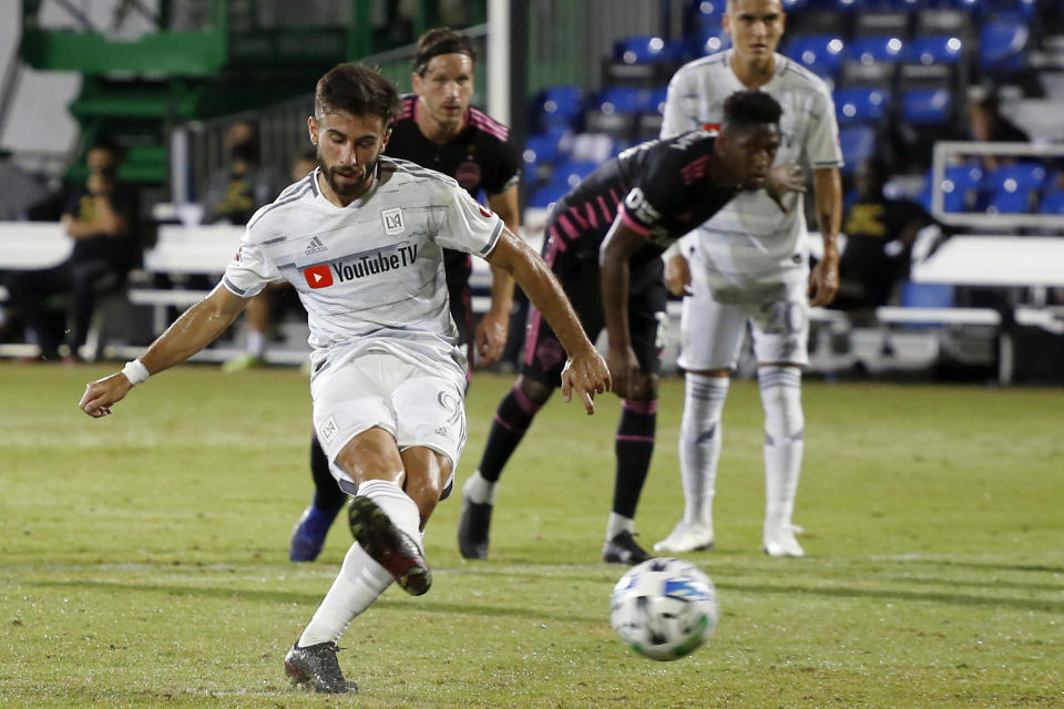 FILE - Los Angeles FC forward Diego Rossi (9) scores on a penalty kick against the Seattle Sounders during the first half of an MLS soccer match in Kissimmee, Fla., in this Monday, July 27, 2020, file photo. Nobody was better at finding the back of the net than Diego Rossi of Los Angeles FC a season ago. (AP Photo/Reinhold Matay, File)