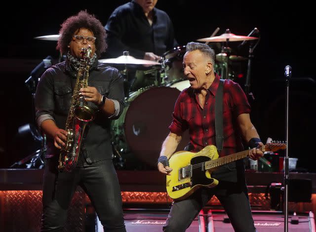 <p>John Medina/Getty </p> Jake Clemons and Bruce Springsteen perform on stage in Phoenix, Arizona on March 19, 2024