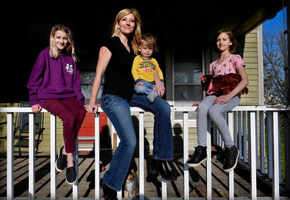 Jennifer Williams’ family moved to a rural plot near Spring Hill for the peace and quiet. She home schools the children — from left, Seven, Lorenzo and Indigo — and works at home as a tax preparer. Her husband works as a welder in his own shop.