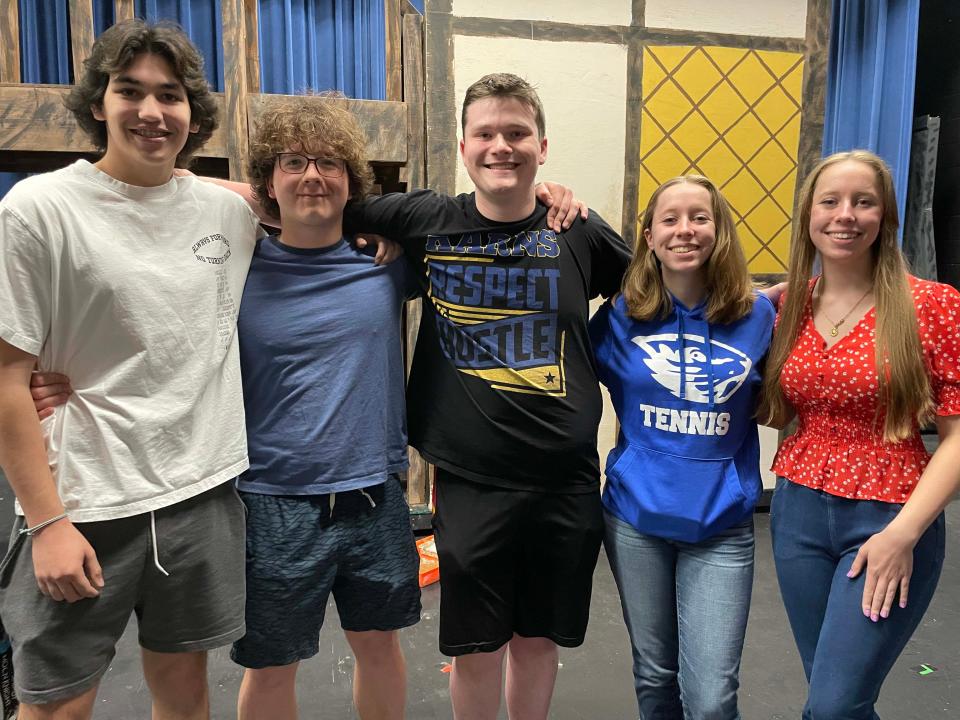 Lead cast members pause during rehearsals for “Oliver!” at Karns High School, April 23, 2024. From left: Brendan Davis, 16, plays Bill Sikes; Jack Pinkston, 17, plays Fagin; Jace Krugjohann, 17, plays Mr. Bumble; Malin Watkins, 17, Mrs. Sowerberry; and Miranda Watkins, 17, Widow Corney.