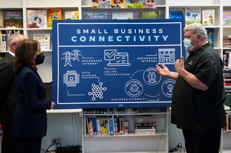 US Vice President Kamala Harris (L) speaks with small business owner Troy Bijeaux as she tours Armand J. Brinkhaus Community Library while speaking about accessible internet in Sunset, LA, on March 21, 2022. - Harris is visiting the State of Louisiana to highlight the administrations investment in high-speed internet for smaller communities. (Photo by Jim WATSON / AFP) (Photo by JIM WATSON/AFP via Getty Images)