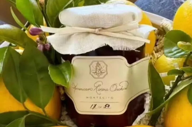 Meghan Markle's new brand's first product = strawberry jam American Riviera Orchard, in a jar among some lemons