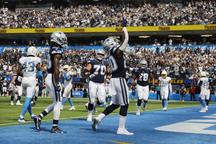 INGLEWOOD, CA - SEPTEMBER 19, 2021: Dallas Cowboys running back Tony Pollard (20) reacts after scoring in the first half agains the Chargers at SoFi Stadium on September 19, 2021 in Inglewood, California.(Gina Ferazzi / Los Angeles Times)