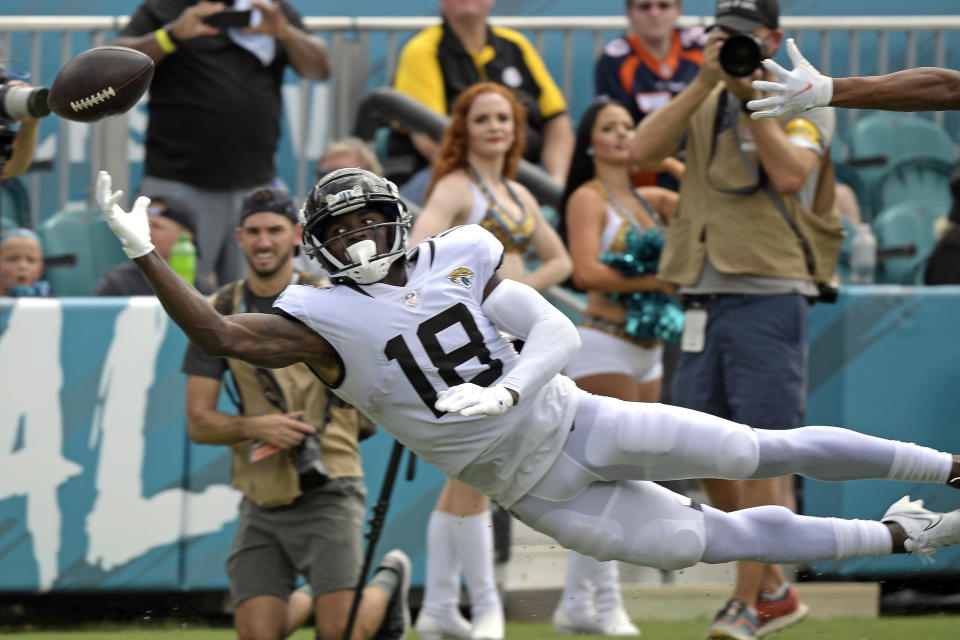 Jacksonville Jaguars wide reciever Laquon Treadwell (18) reaches but can't make the catch on a pass during the first half of an NFL football game against the Denver Broncos, Sunday, Sept. 19, 2021, in Jacksonville, Fla. (AP Photo/Phelan M. Ebenhack)