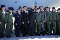 NATO Secretary-General Jens Stoltenberg, center, prepares to take a group photo with Japan Self-Defense members at Iruma Air Base in Sayama, northwest of Tokyo, Tuesday, Jan. 31, 2023. (AP Photo/Eugene Hoshiko)