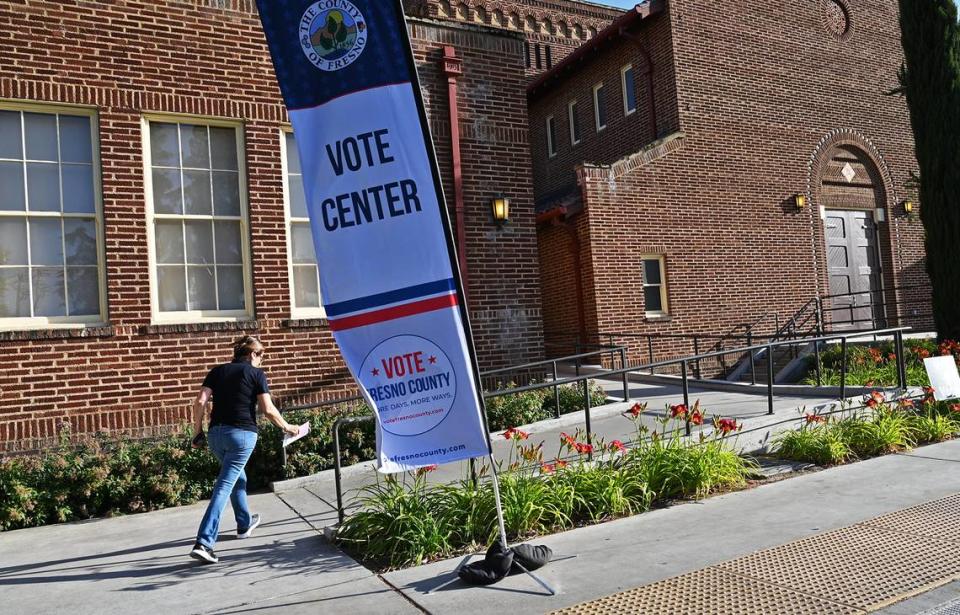 A voter hurries into the voting center at Fresno City College’s Old Administration Building on Tuesday, June 7, 2022 in Fresno. Voter turnout for the June primary in Fresno County was less than 27% – the second lowest for a midterm primary since 1982.