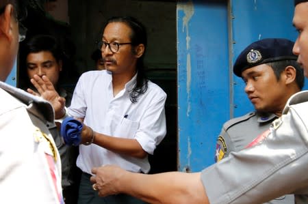 FILE PHOTO: Filmmaker Min Htin Ko Ko Gyi arrives at Insein court before his trial in Yangon