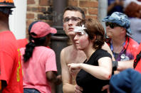 <p>A woman who was injured when a car drove through a group of counter protestors at the “Unite the Right” rally is helped in Charlottesville, Virginia, U.S., Aug. 12, 2017. (Photo: Joshua Roberts/Reuters) </p>