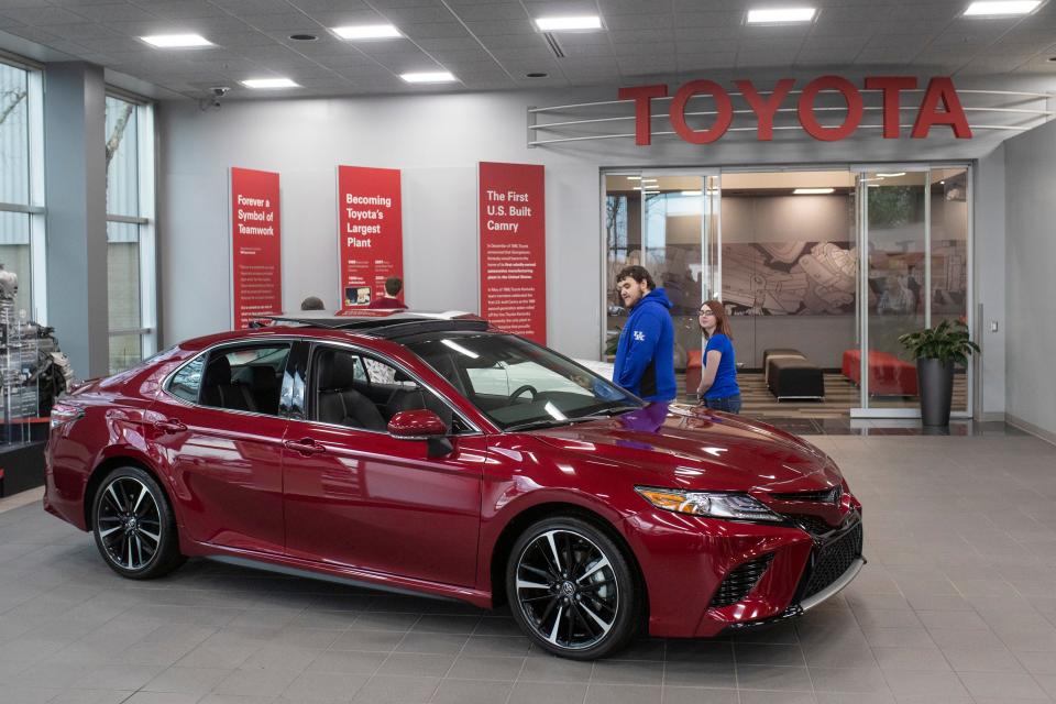 Visitors tour the showroom area at the Kentucky Toyota Plant in Georgetown, Kentucky on Thursday. Toyota announced the future production of the new Lexus ES 300 Hybrid and the RAV4 Hybrid at the Georgetown, Kentucky plant on Thursday. The car company plans to invest $13 billion over the next five years in the U.S. with $238 million coming to Kentucky. March 14, 2019