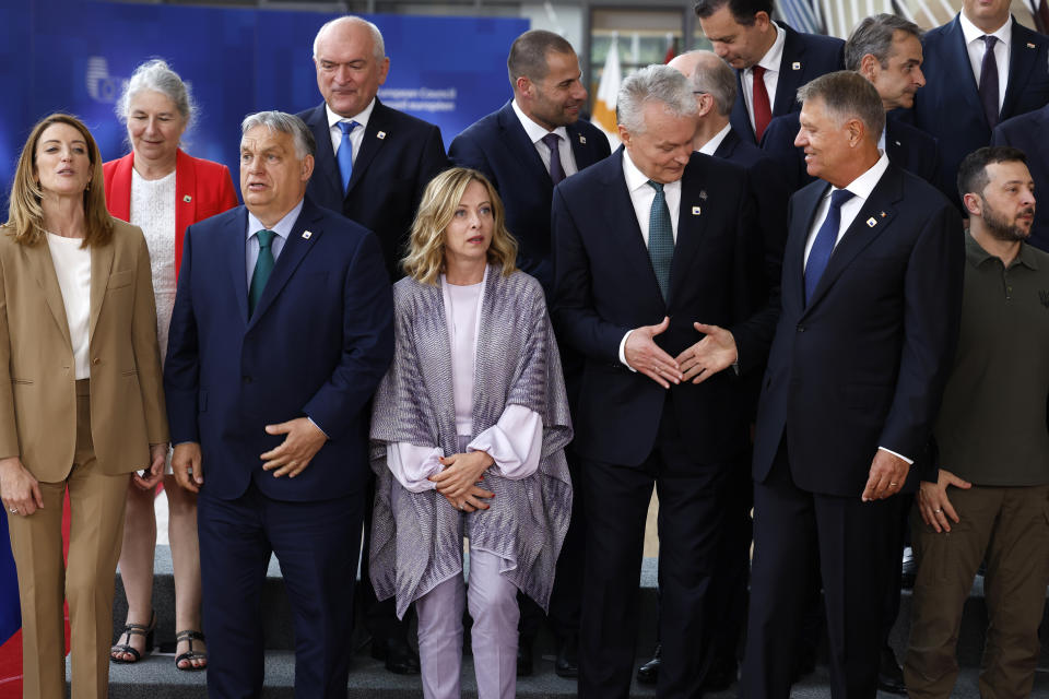 Front fow left to right, European Parliament President Roberta Metsola, Hungary's Prime Minister Viktor Orban, Italy's Prime Minister Giorgia Meloni, Lithuania's President Gitanas Nauseda, Romania's President Klaus Werner Ioannis and Ukraine's President Volodymyr Zelenskyy during a group photo at an EU summit in Brussels, Thursday, June 27, 2024. European Union leaders are expected on Thursday to discuss the next EU top jobs, as well as the situation in the Middle East and Ukraine, security and defence and EU competitiveness. (AP Photo/Geert Vanden Wijngaert)