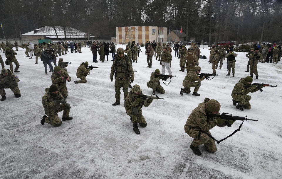 Members of Ukraine's Territorial Defense Forces, volunteer military units of the Armed Forces, train close to Kyiv, Ukraine, Saturday, Feb. 5, 2022. Hundreds of civilians have been joining Ukraine's army reserves in recent weeks amid fears about a Russian invasion. (AP Photo/Efrem Lukatsky)