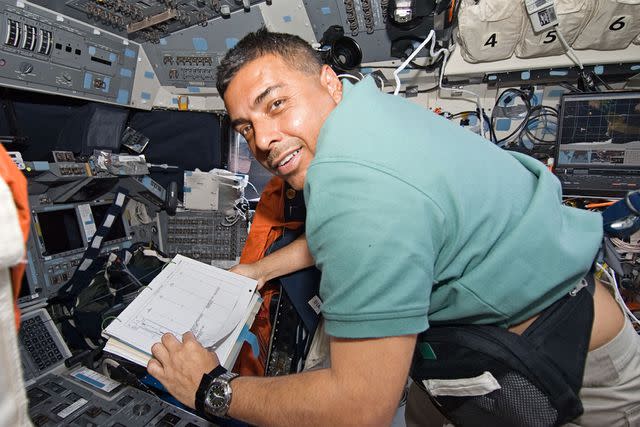 <p>NASA</p> STS-128 mission specialist José Hernández, on the flight deck of Space Shuttle Discovery