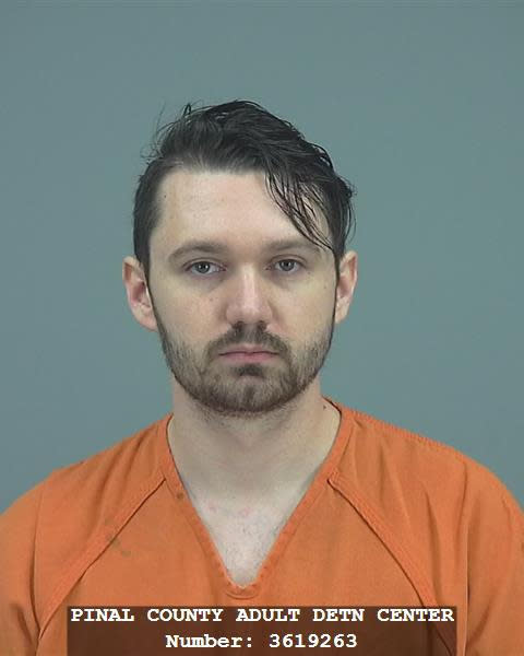 CORRECTS LAST NAME OF MOTHER FROM HACKNEY TO HOBSON - This undated photo provided by the Pinal County Sheriff's Office shows Ryan Hackney. Hackney and his brother, Logan Hackney, were arrested on suspicion of failing to report abuse of a minor after authorities said they discovered that their mother, Machelle Hobson, had used pepper spray to discipline her seven younger adopted children and locked them for days inside a closet. (Pinal County Sheriff's Office via AP, file)