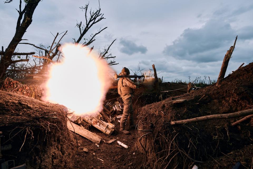 A Ukrainian soldier fires a RPG toward Russian positions at a frontline near Avdiivka, in the Donetsk region, Ukraine, Friday, April 28, 2023.