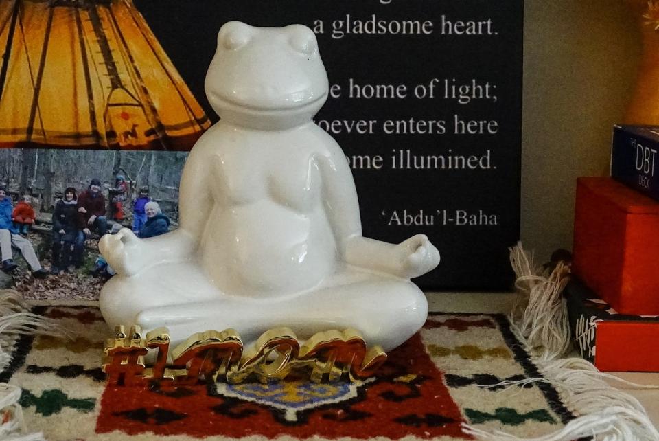 A Zen Buddha frog sits on a table in Farhoumand-Sims' home