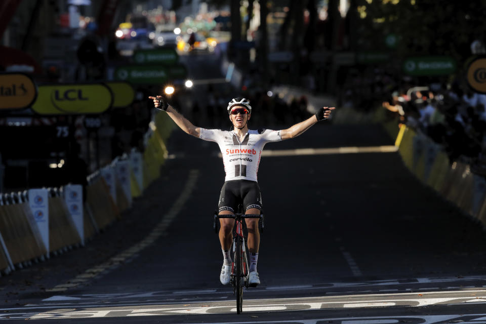 Denmark's Soren Kragh Andersen crosses the finish line to win the 14th stage of the Tour de France cycling race over 194 kilometers (120,5 miles) with start in Clermont-Ferrand and finish in Lyon, France, Saturday, Sept. 12, 2020. (AP Photo/Christophe Ena, Pool)