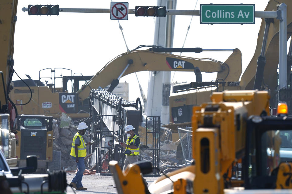 Crews work in the rubble of the Champlain Towers South building, as removal and recovery work continues at the site of the partially collapsed condo building, Tuesday, July 13, 2021, in Surfside, Fla. (AP Photo/Lynne Sladky)