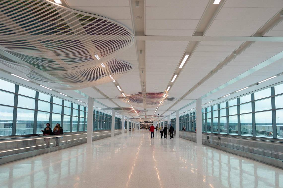 A corridor entering gates B-40 to 69 are illuminated by windows at Kansas City International Airport on Tuesday.