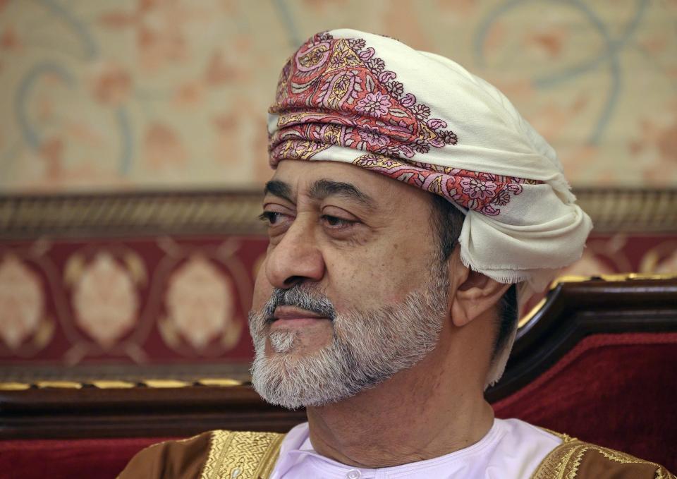 FILE - In this Feb. 21, 2020 file photo, Oman's ruler Sultan Haitham bin Tariq prepares for a meeting at al-Alam palace in the capital Muscat, Oman. The sultan announced Monday, Jan. 11, 2021, a shake-up of the country’s constitution with changes that include the appointment of a crown prince for the first time and steps to boost government transparency. The move, one year after the death of Sultan Qaboos bin Said comes as the government faces growing economic pressures at home. (Andrew Caballero-Reynolds/Pool via AP, File)