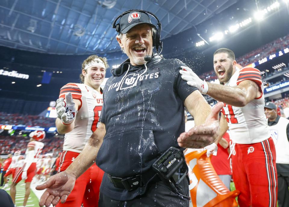 Utah head coach Kyle Whittingham is doused in celebration at the Pac-12 championship.