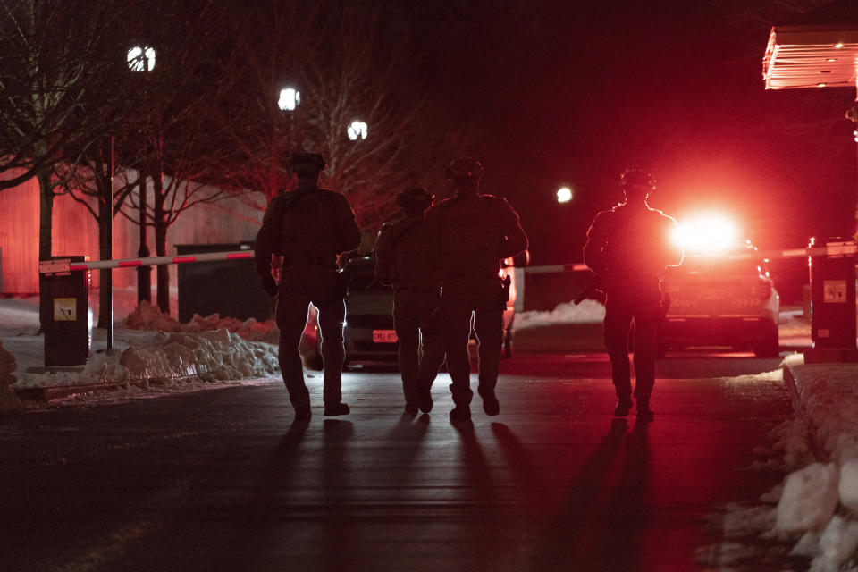 York Regional Police tactical officers work the scene of a shooting in Vaughan, Ontario, Sunday, Dec. 18, 2022. Police said multiple people are dead, including the suspect, after a shooting in an apartment building. (Arlyn McAdorey/The Canadian Press via AP)