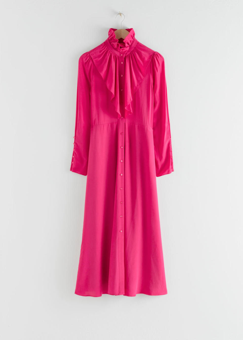 The fuchsia frock costs £85 from the high street shop. (& Other Stories)