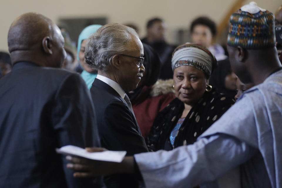 The Rev. Al Sharpton, center left, civil rights activist and founder of the National Action Network, greets family and friends of 19-year-old fatal shooting victim Mubarak Soulemane, Sunday, Jan. 26, 2020, during ceremonies to honor Soulemane's life, at the First Calvary Baptist Church, in New Haven, Conn. The Jan. 15, 2020 shooting by a Connecticut State Police trooper took Soulemane's life following a high-speed car chase, in West Haven, Conn. (AP Photo/Steven Senne)