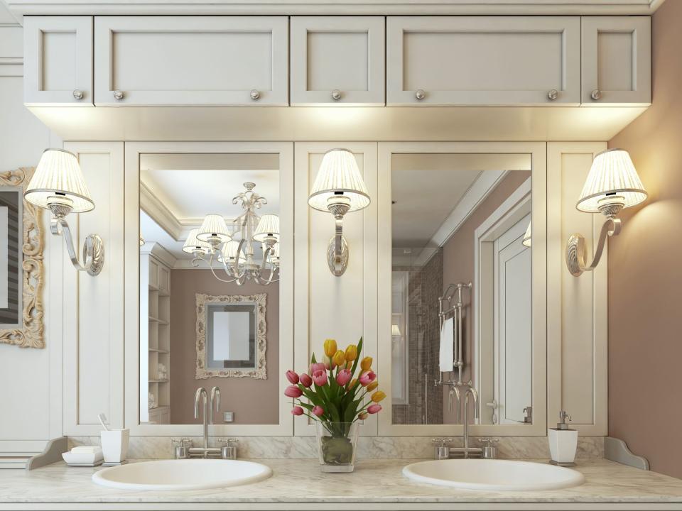 White vanity with sconces