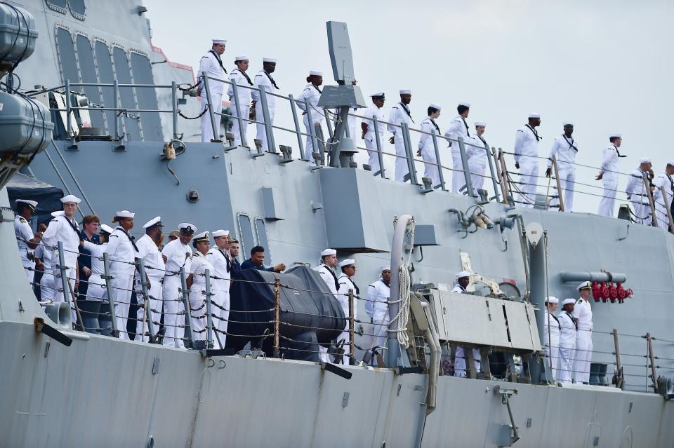 Crew members of the USS Mason line the rails as the ship arrives at Naval Station Mayport Monday morning. The Arleigh Burke-class guided-missile destroyer had been home-ported in Norfolk , and has been relocated to Mayport.