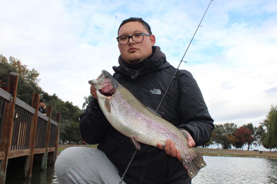 Andy Pamintuan of Stockton took first place in the adult division of the Trout Bout with his rainbow weighing 8 pounds, 3.8 ounces.