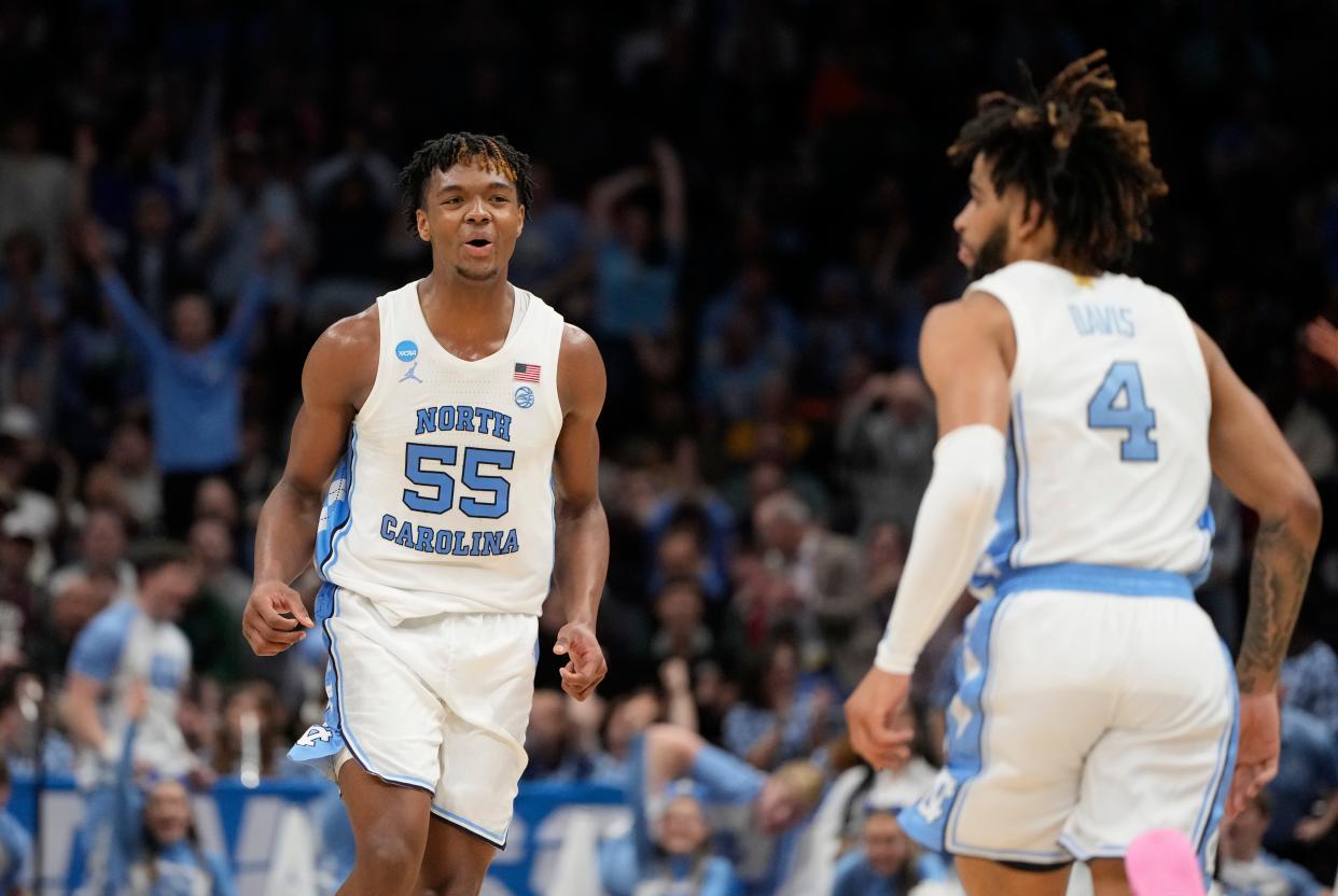 March 23, 2024, Charlotte, NC, USA; North Carolina Tar Heels forward Harrison Ingram (55) and North Carolina Tar Heels guard RJ Davis (4) react against the Michigan State Spartans in the second round of the 2024 NCAA Tournament at the Spectrum Center. Mandatory Credit: Bob Donnan-USA TODAY Sports