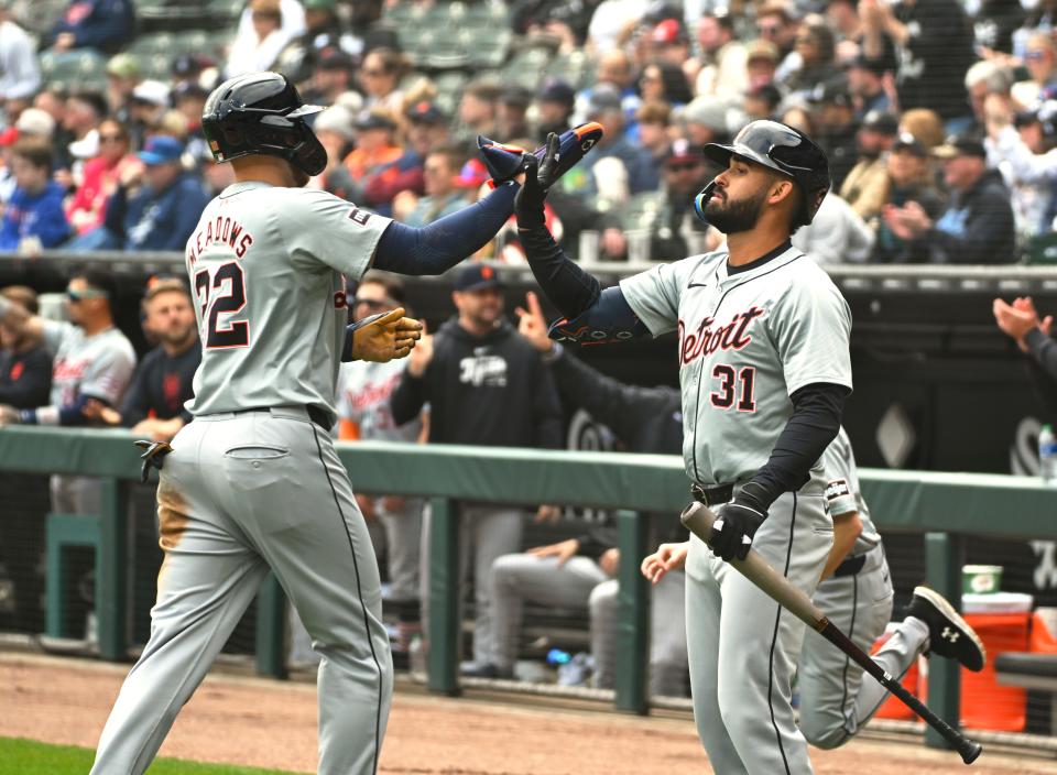 Parker Meadows of the Detroit Tigers is congratulated by Riley Greene after he scored during the first inning against the Chicago White Sox at Guaranteed Rate Field on March 30, 2024 in Chicago.