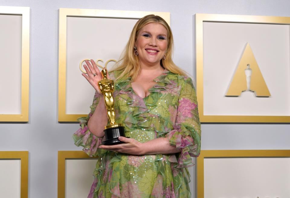 Emerald Fennell, winner of the award for best original screenplay for "Promising Young Woman," poses in the press room at the Oscars on Sunday.