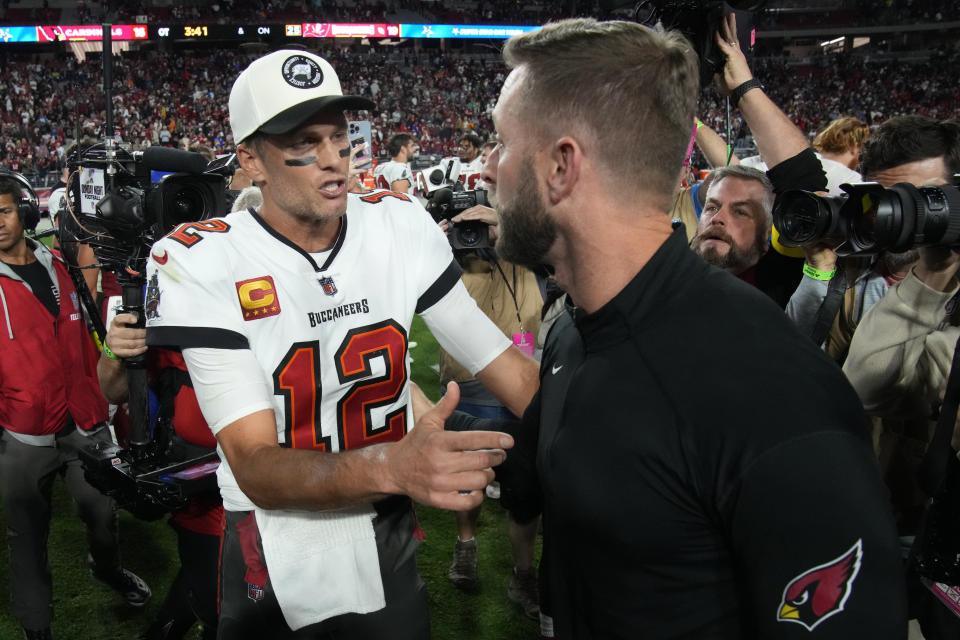 Tampa Bay Buccaneers quarterback Tom Brady (12) greets Arizona Cardinals head coach Kliff Kingsbury after an NFL football game, Sunday, Dec. 25, 2022, in Glendale, Ariz. The Buccaneers defeated the Cardinals 19-16 in overtime. (AP Photo/Rick Scuteri)