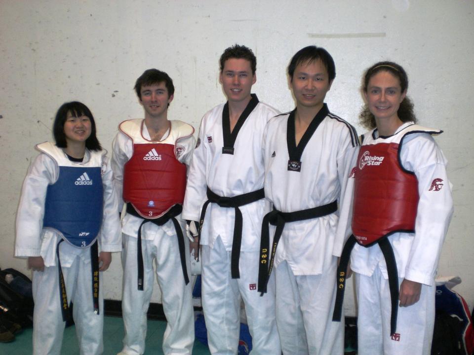 The author (right) beside one of her Taekwondo instructors, Leslie Cheung (to her left), as well as other club members.