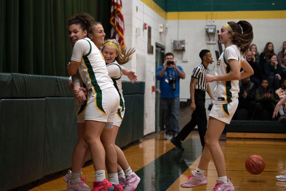 Lansdale Catholic senior Gabby Casey cheers with her teammates after becoming the school's all-time leading scorer in girls basketball during their game against Bonner and Prendergast Catholic at Lansdale Catholic High School on Tuesday, Jan. 10, 2023.