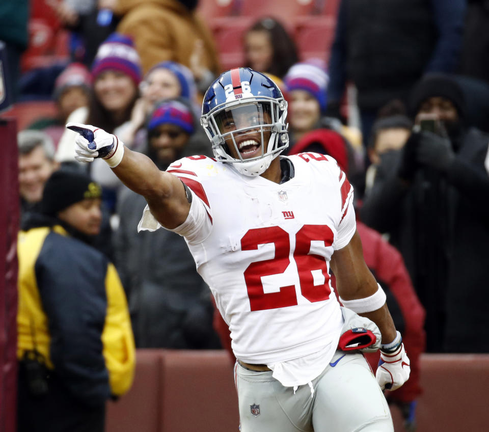 FILE - In this Sunday, Dec. 9, 2018 file photo,New York Giants running back Saquon Barkley (26) celebrates his 78-yard touchdown during the first half of an NFL football game against the Washington Redskins in Landover, Md. How popular is Saquon Barkley? Well, lots of fans want to look like him. Enough so that Barkley tops the DICK'S Sporting Goods Jersey report for sales. (AP Photo/Patrick Semansky, File)