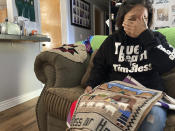 Seraphine Warren cries as she talks about her missing aunt, Navajo rug weaver Ella Mae Begay, while holding a rug made by Begay at her home in Tooele, Utah, on Sept. 23, 2021. Begay, 62, disappeared in June, one of thousands of missing Indigenous women across the U.S. The extensive coverage of the Gabby Petito case is renewing calls to also shine a spotlight on missing people of color. (AP Photo/Lindsay Whitehurst)
