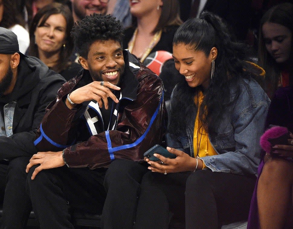 Chadwick Boseman and Taylor Simone Ledward attend the 69th NBA All-Star Game at United Center on February 16, 2020 in Chicago, Illinois.