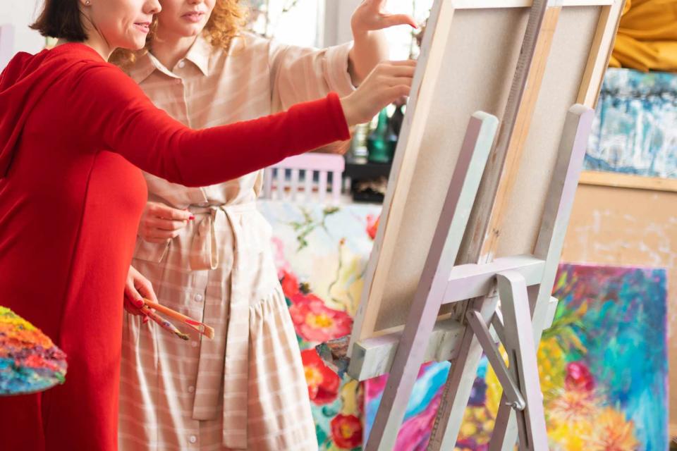 <p>Getty</p> A stock image of women painting