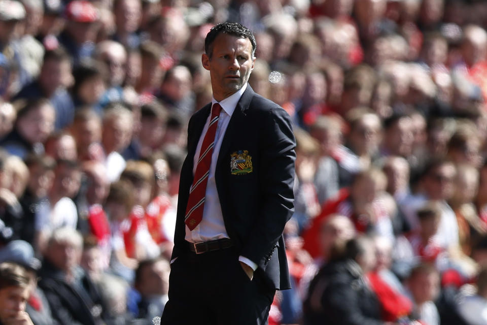 Manchester United's interim manager Ryan Giggs watches his team play against Southampton during their English Premier League soccer match at St Mary's stadium, Southampton, England, Sunday, May 11, 2014. (AP Photo/Sang Tan)