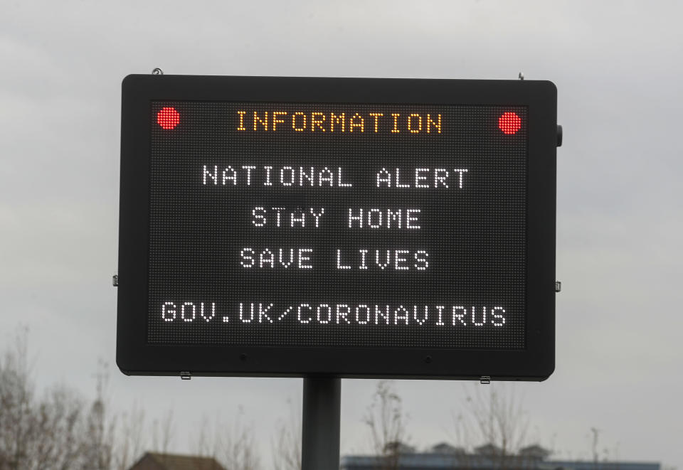 An information sign in Staines-upon-Thames, Surrey, advising to stay at home and save lives in the final week of a four week national lockdown to curb the spread of coronavirus. (Photo by Steve Parsons/PA Images via Getty Images)