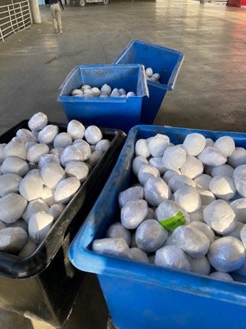 Packages of meth can be seen within a shipment of onions confiscated in San Diego on Sunday, Feb. 20.