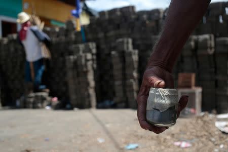 A man carries a homemade bomb in front of a barricade in the indigenous community of Monimbo in Masaya, July 11. REUTERS/Oswaldo Rivas